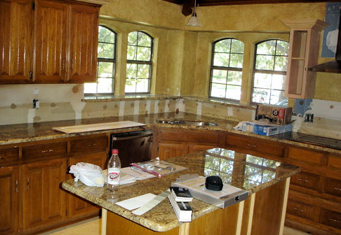 Dark colored cabinets before painting