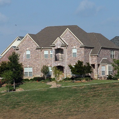 Exterior of brick home in Cross Roads by Platinum Painting