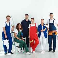 a team of painters smiling   