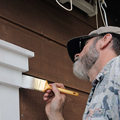 Man painting trim