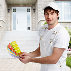 Man holding paint color samples