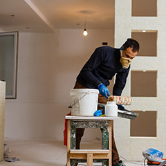 Team member prepping for painting