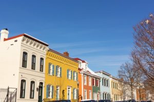 a row of painted brick homes