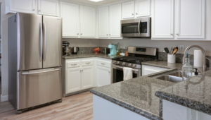 a kitchen with several stainless steel appliances
