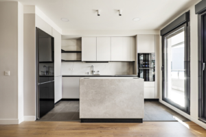 a kitchen with several handleless cabinets 