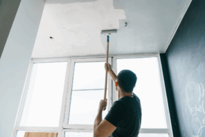 a person painting the interior of their home
